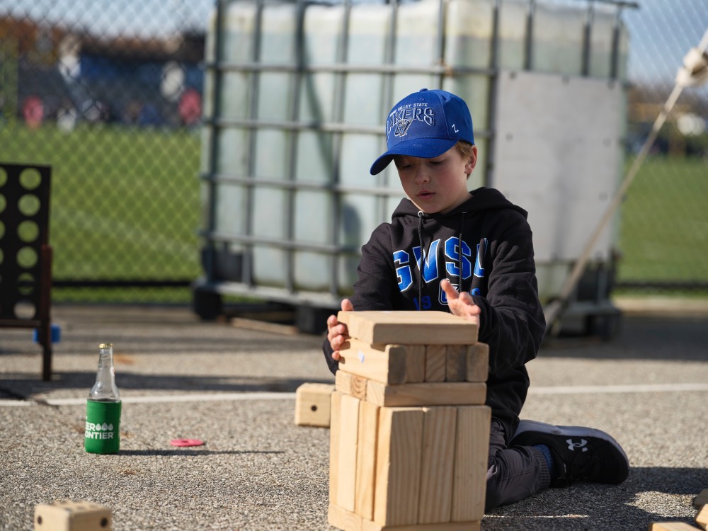 Little boy playing Jenga